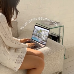 a person with their laptop indoors