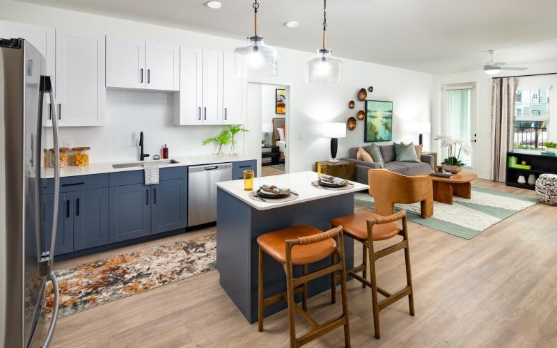 a kitchen with a dining table and couches