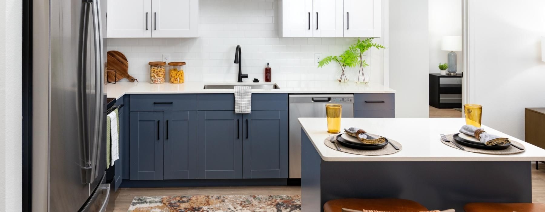 a kitchen with a table and chairs